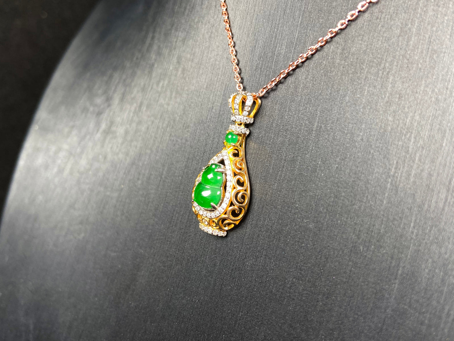 A rich green fortune gourd jadeite pendant.