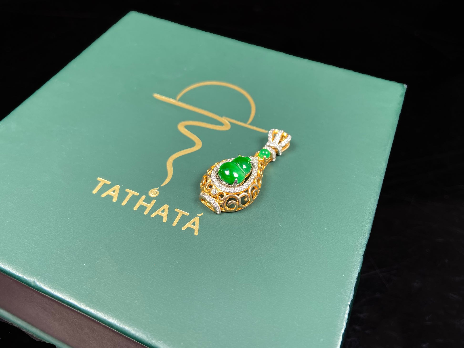 A rich green fortune gourd jadeite pendant.