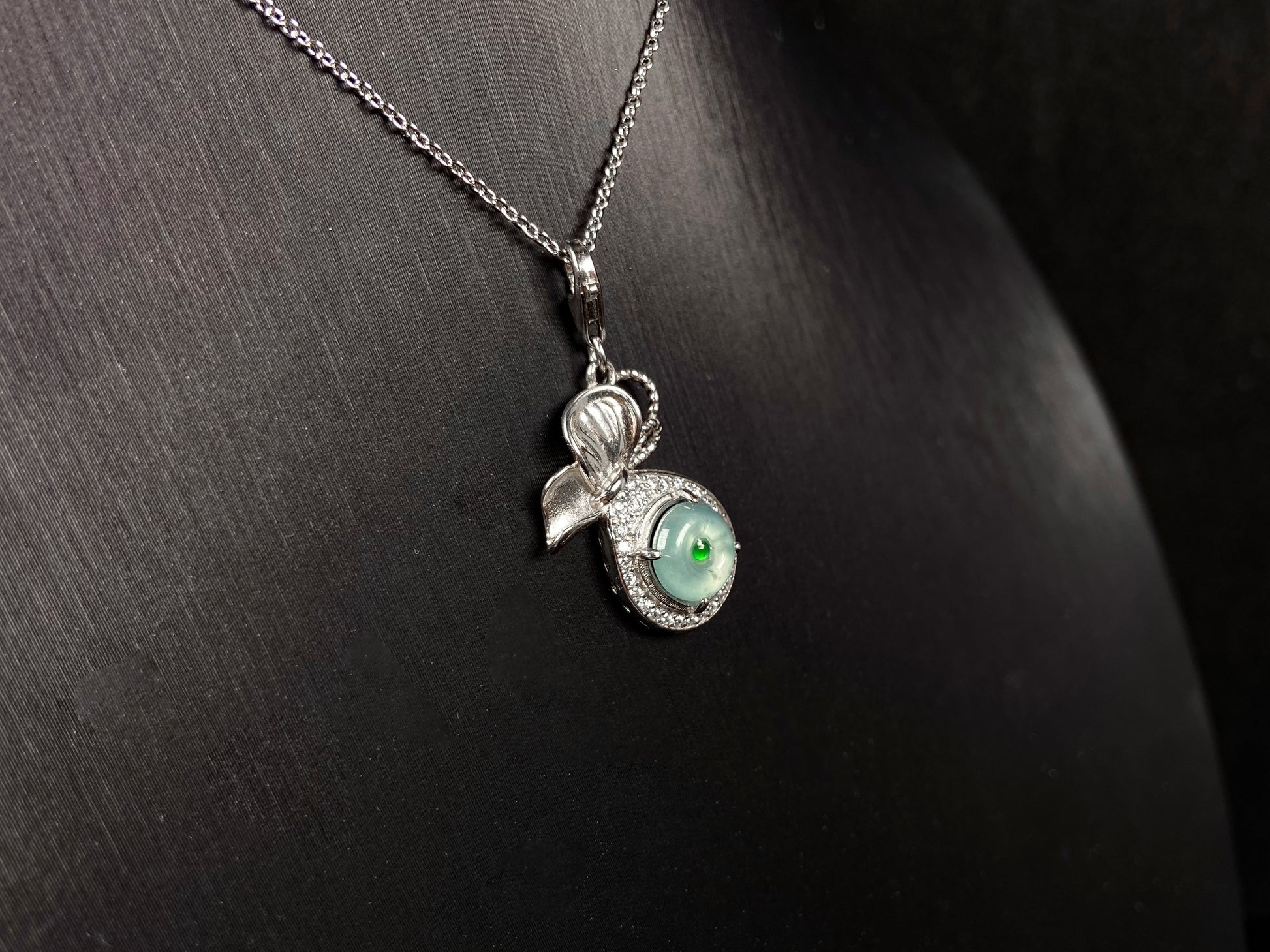 A icy green wealth pouch jadeite pendant.