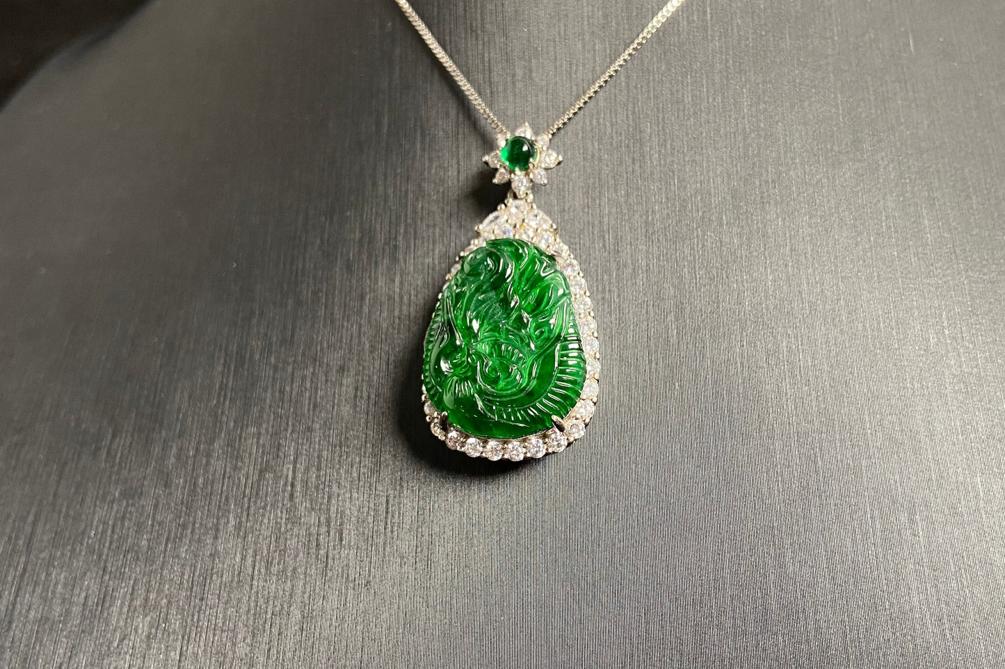 A green jade phoenix, symbolizing good fortune and prosperity, elegantly set in 925 silver.