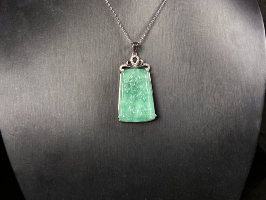 A icy green dragon sparkle jadeite pendant.