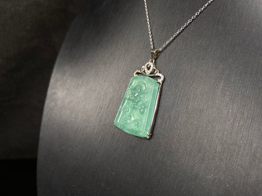 A icy green dragon sparkle jadeite pendant.