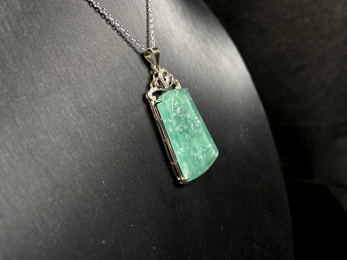 A icy green dragon sparkle jadeite pendant.
