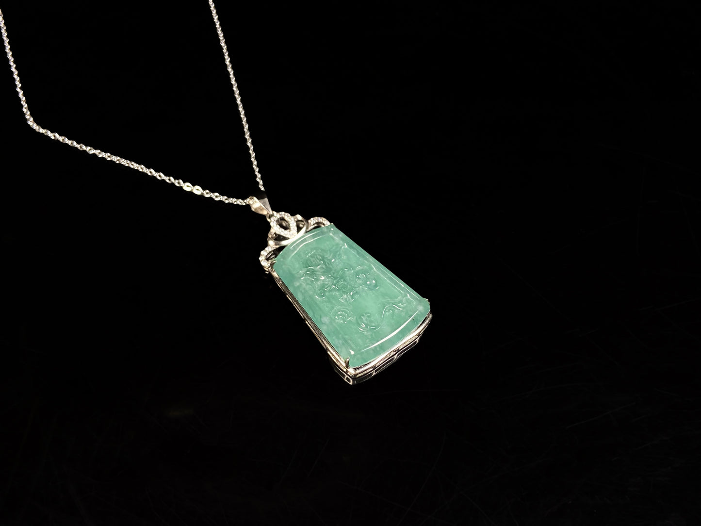 A icy green dragon sparkle jadeite pendant.