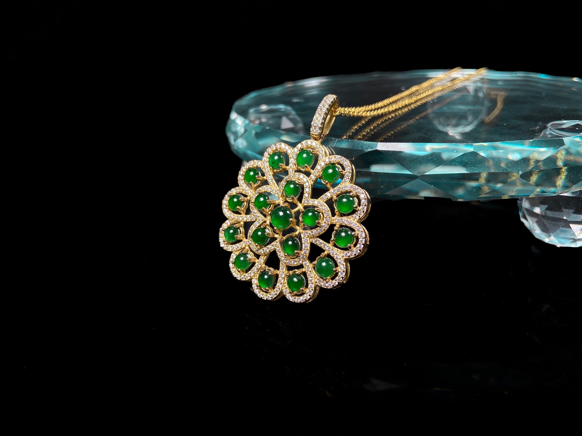 A filigree verdant cluster jadeite pendant.