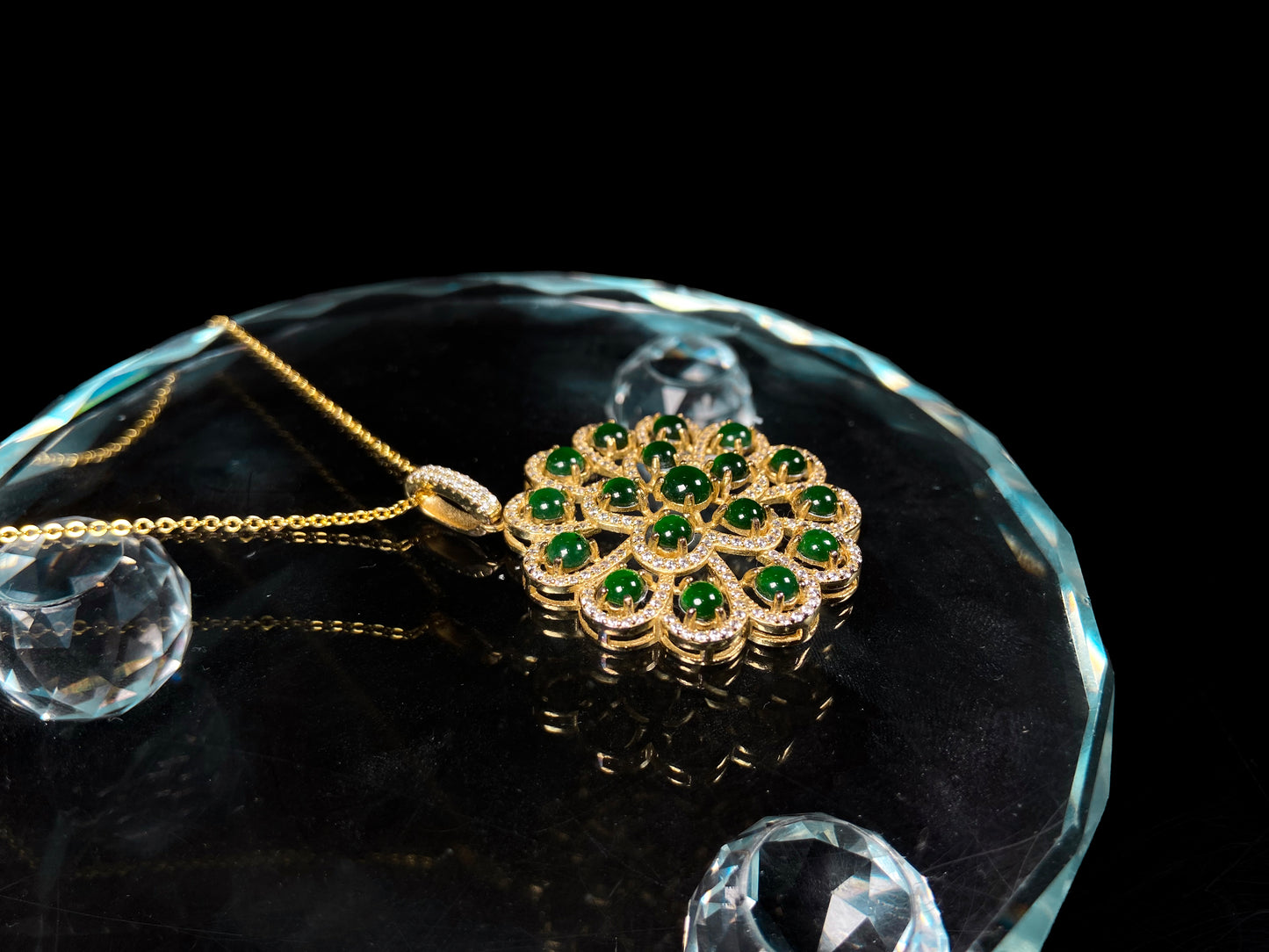A filigree verdant cluster jadeite pendant.