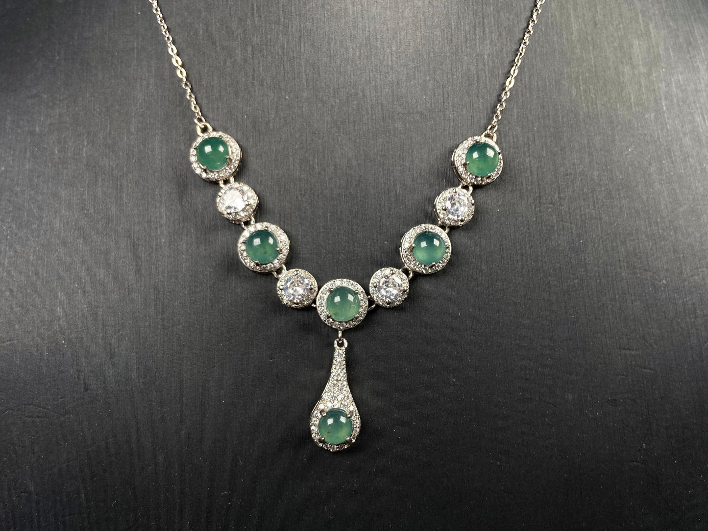 A lush green teardrop jadeite pendant.