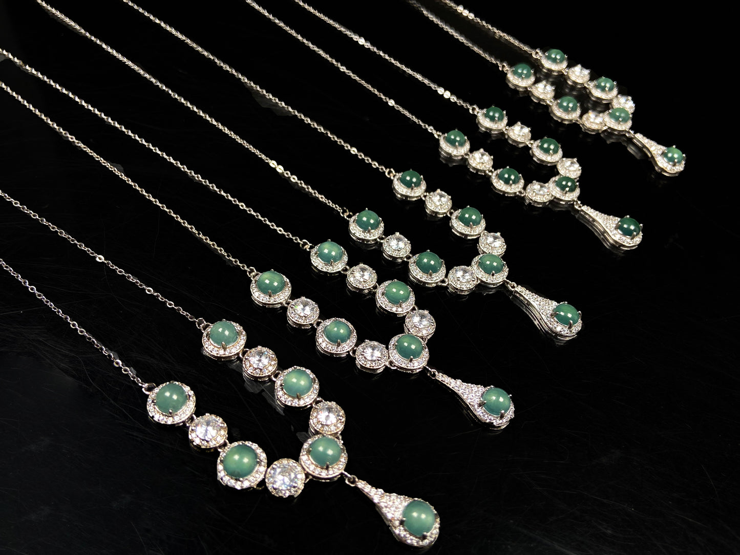 A lush green teardrop jadeite pendant.