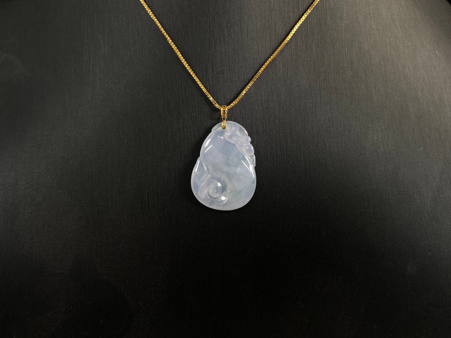 An icy jadeite carving of a Pixiu with a Ruyi body.