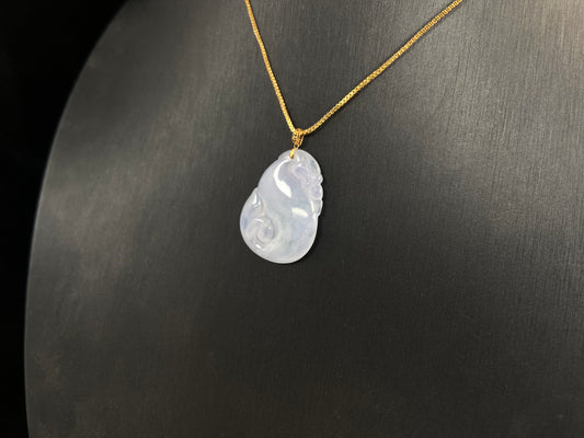 An icy jadeite carving of a Pixiu with a Ruyi body.