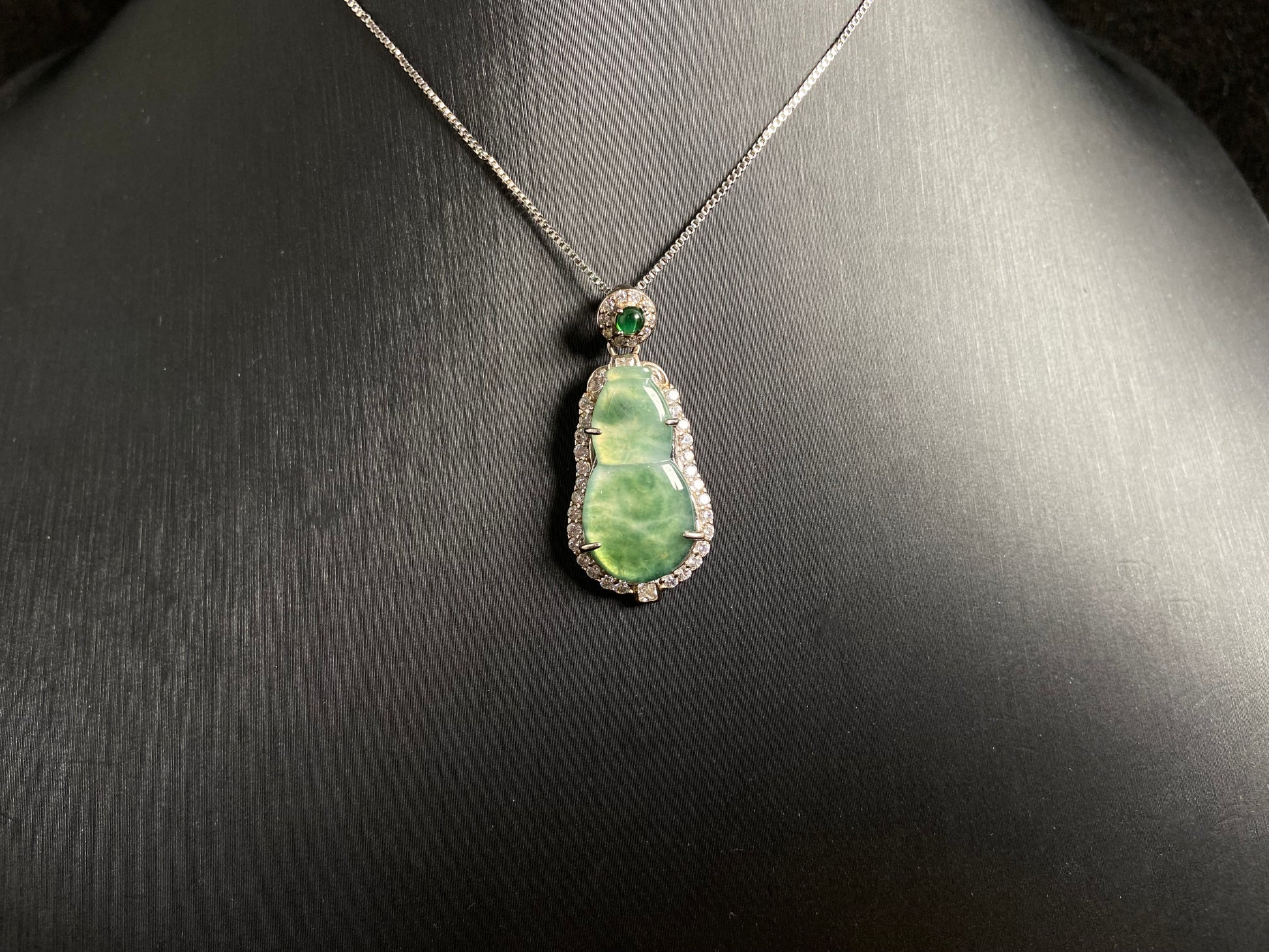 This pendant features a translucent Hulu (gourd) with subtle green veining, elegantly set in 925 silver.