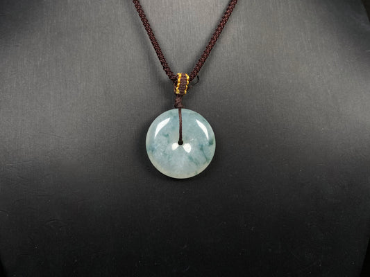A blue green Ping An Kou jadeite pendant.