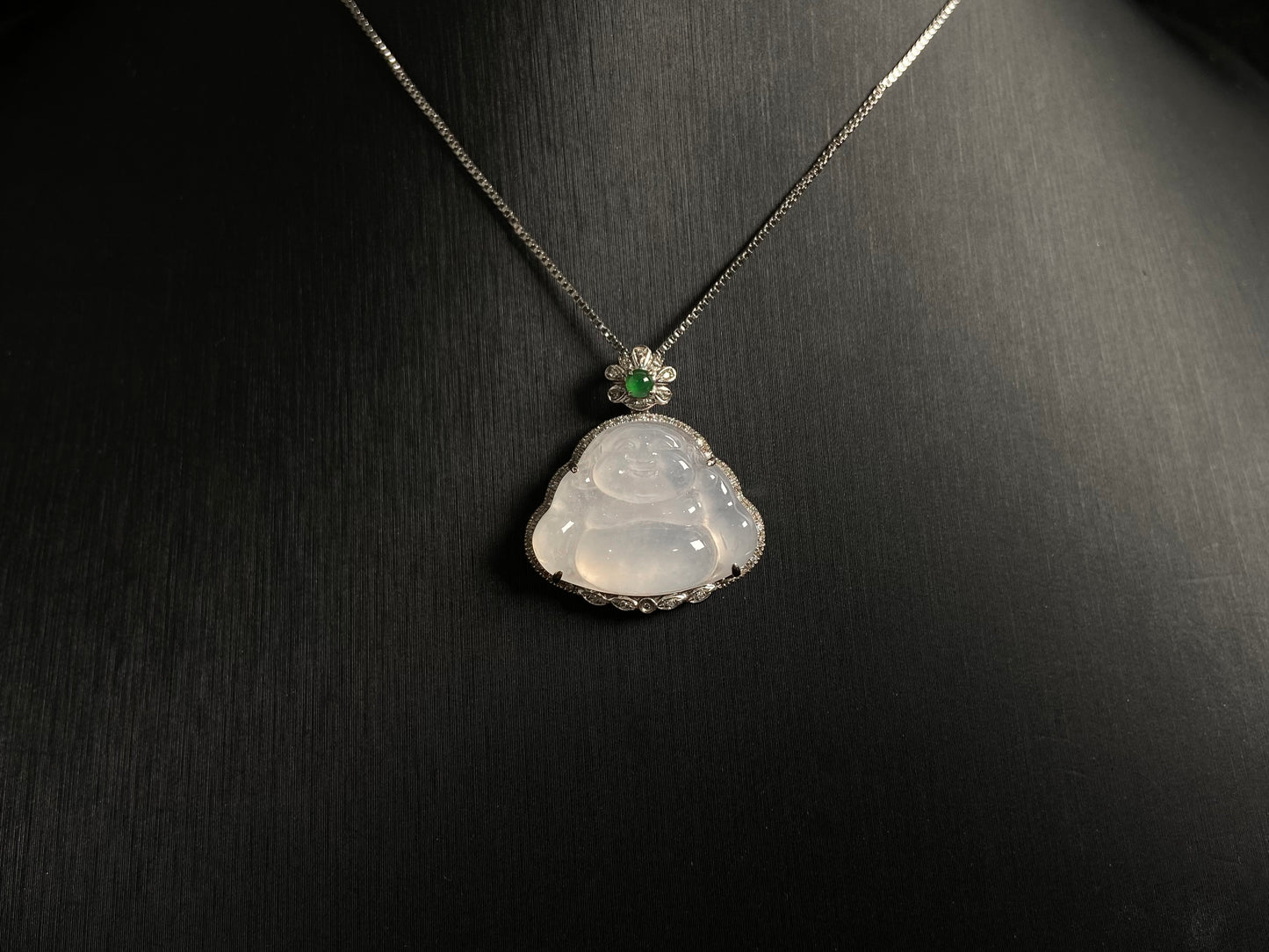 This pendant features a translucent white Maitreya Buddha, symbolizing auspiciousness and protection, set in 18 gold to inspire wisdom and serenity.
