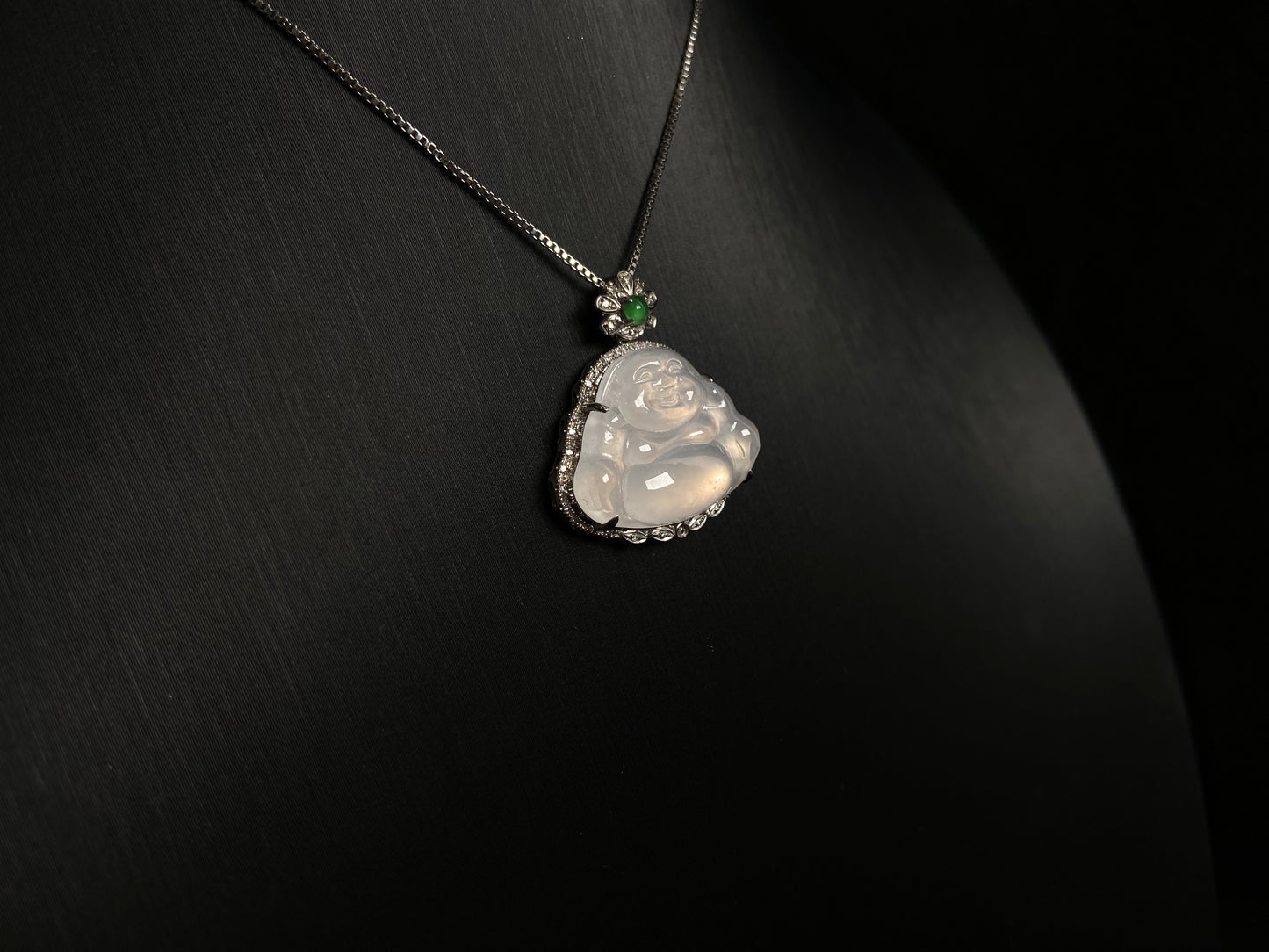This pendant features a translucent white Maitreya Buddha, symbolizing auspiciousness and protection, set in 18 gold to inspire wisdom and serenity.