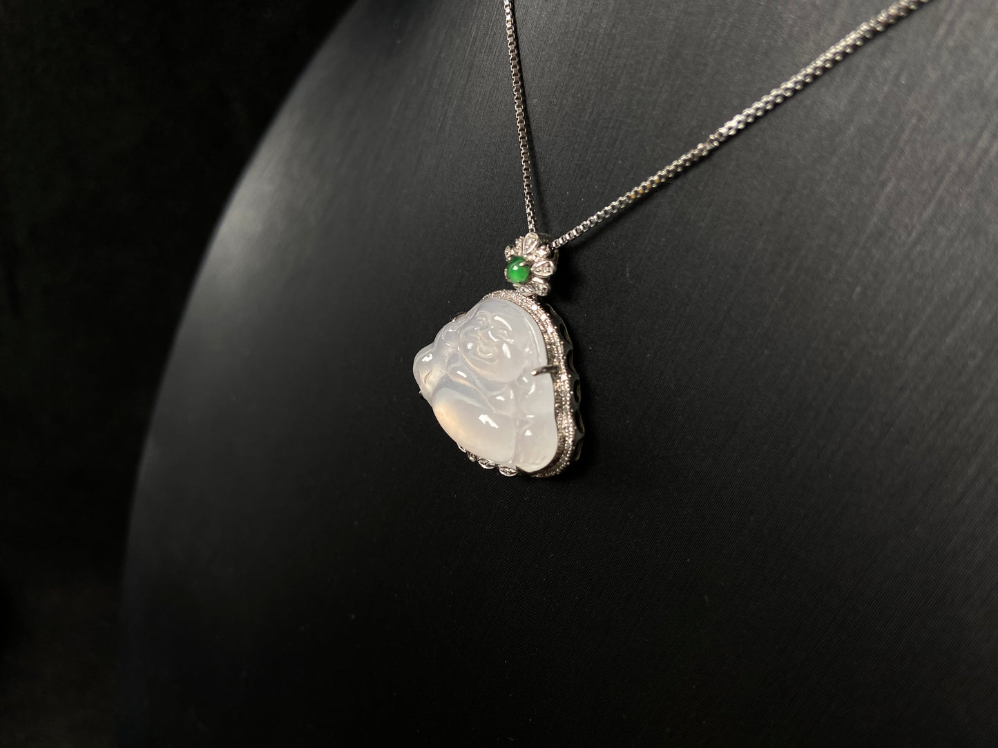 This pendant features a translucent white Maitreya Buddha, symbolizing auspiciousness and protection, set in 18 gold to inspire wisdom and serenity.