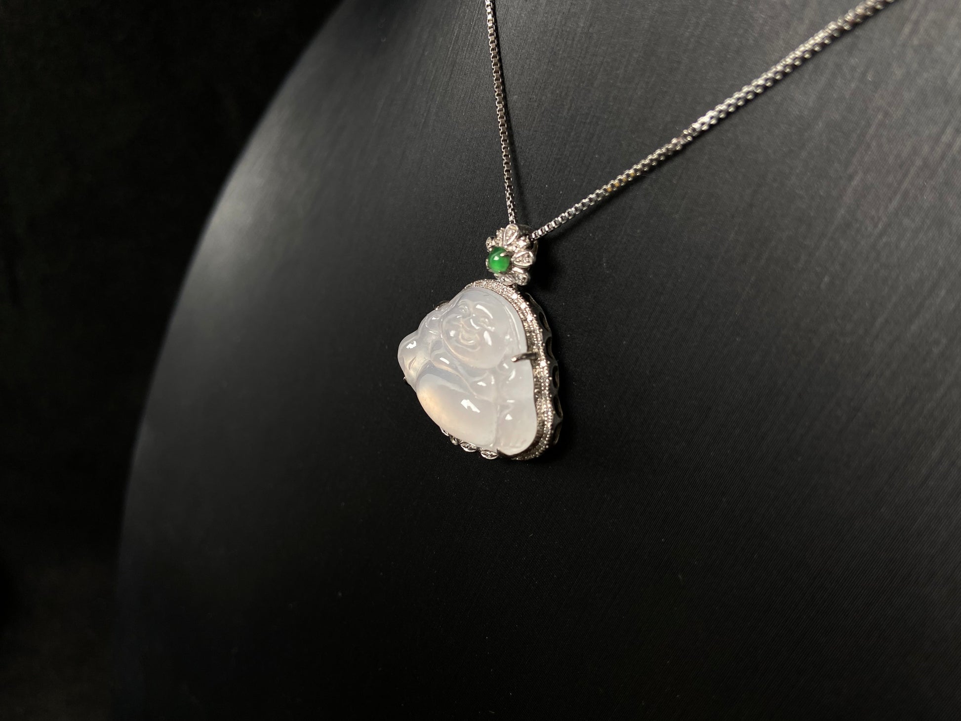 This pendant features a translucent white Maitreya Buddha, symbolizing auspiciousness and protection, set in 18 gold to inspire wisdom and serenity.