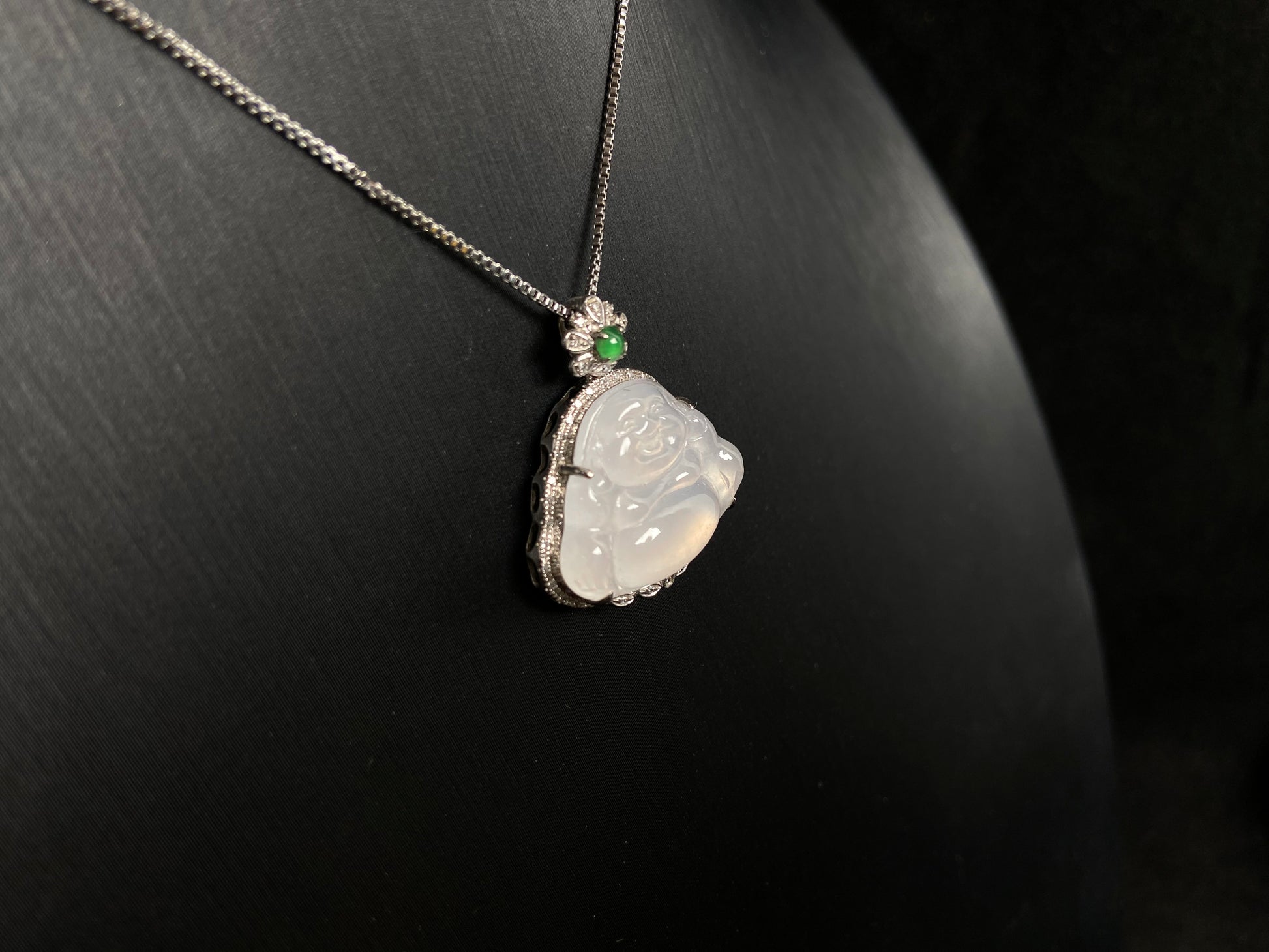 This pendant features a translucent white Maitreya Buddha, symbolizing auspiciousness and protection, set in 18 gold to inspire wisdom and serenity.