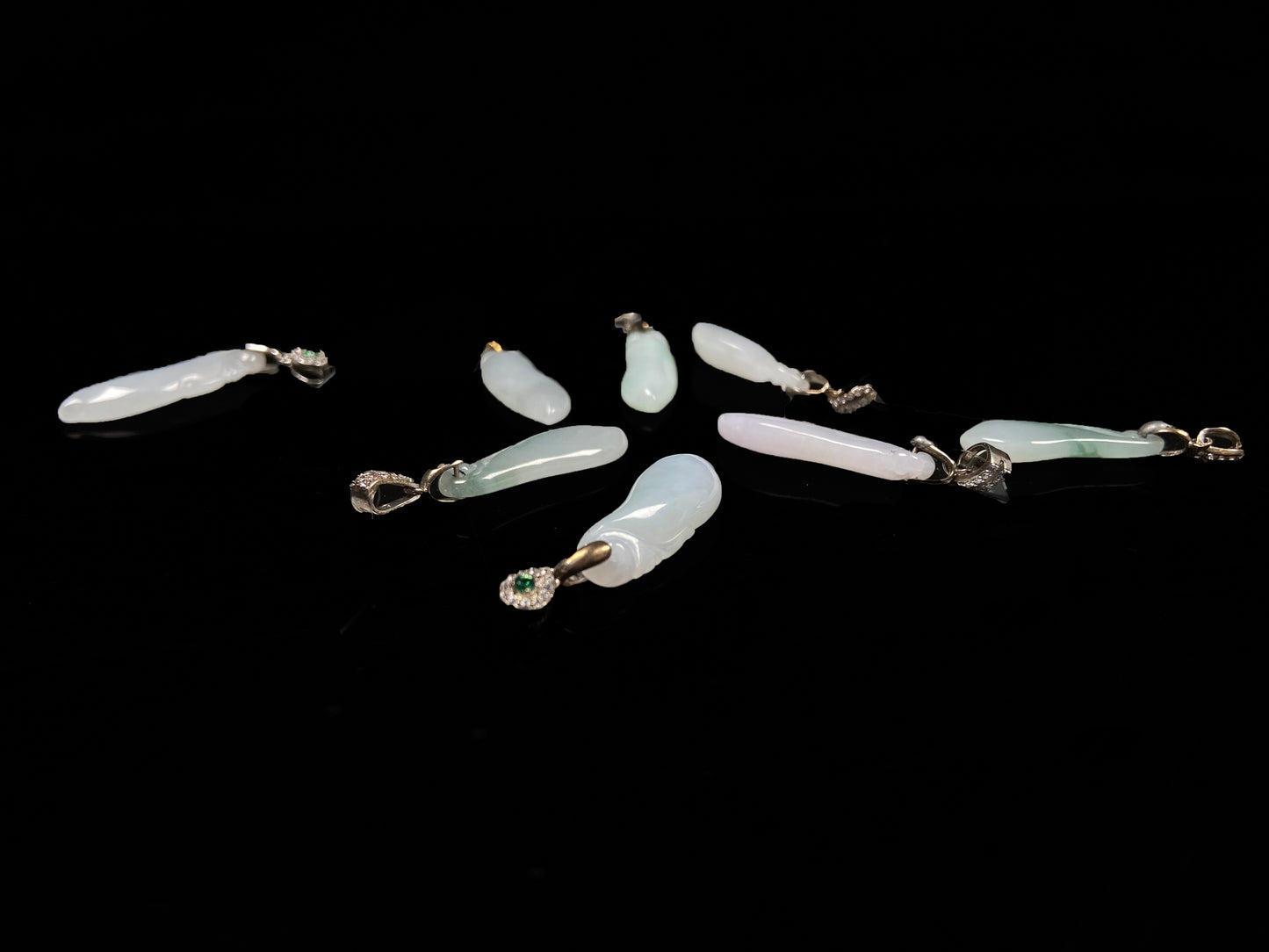 A group of white green smooth fortune melon naJadeite pendant.