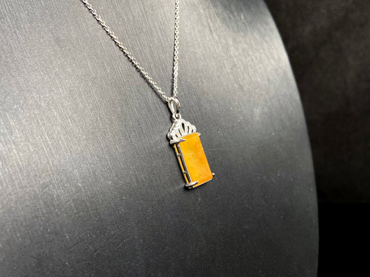 A amber glow of royal crown jadeite pendant.