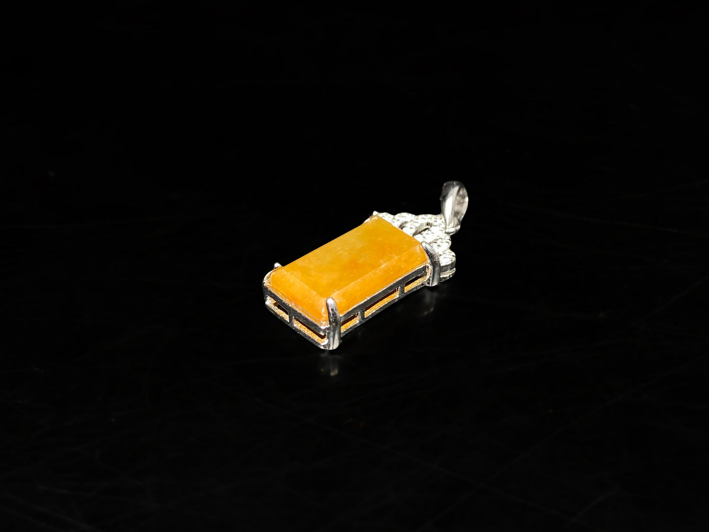A amber glow of royal crown jadeite pendant.