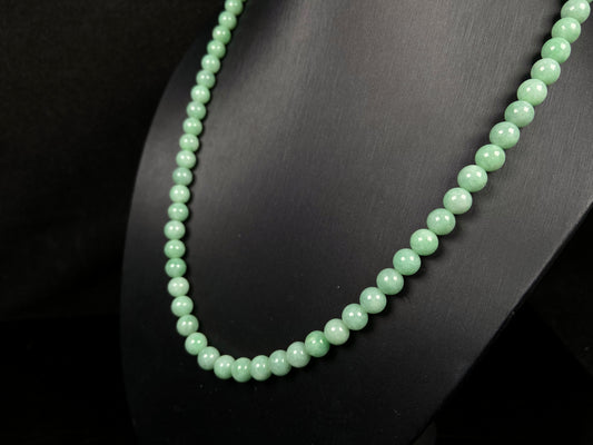 A crisp apple green beads necklace.