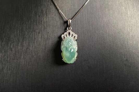 A light green jade Pixiu crowned with a diamond studded 925 silver tiara.