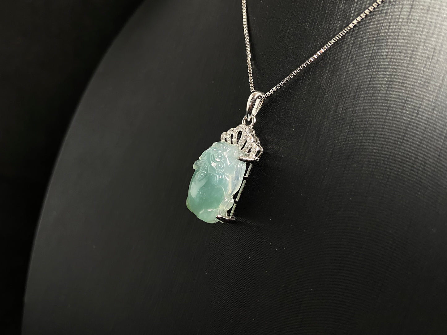A light green jade Pixiu crowned with a diamond studded 925 silver tiara.