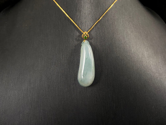 A pendant carved from translucent white jade into the form of a melon a Chinese symbol of good fortune.