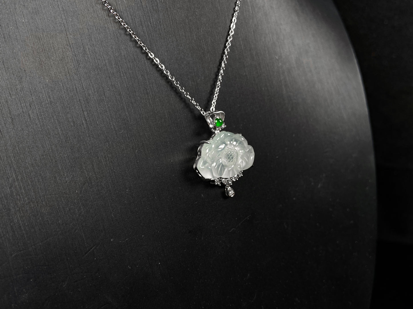 A icy peony with green glow jadeite pendant.