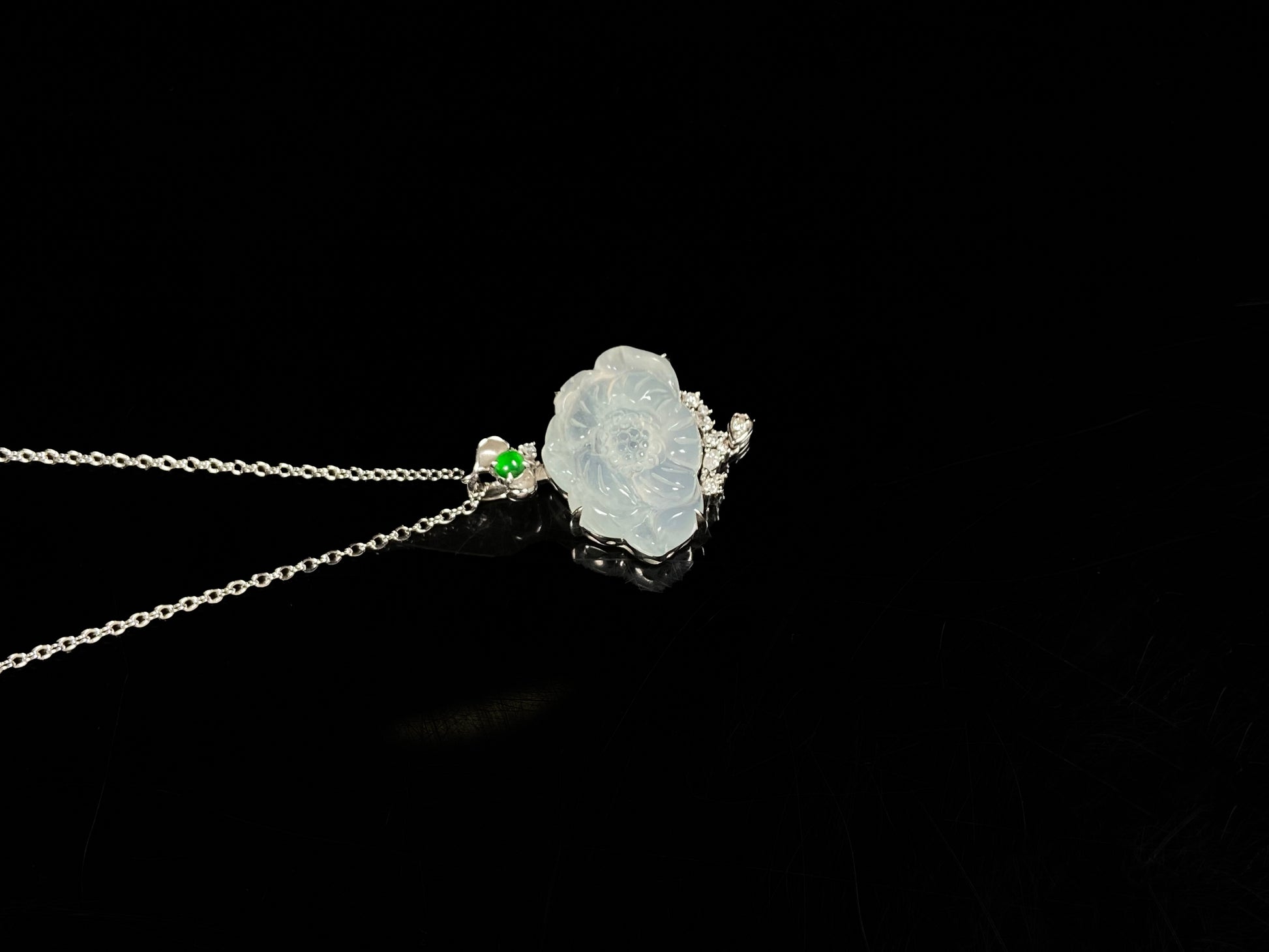 A icy peony with green glow jadeite pendant.