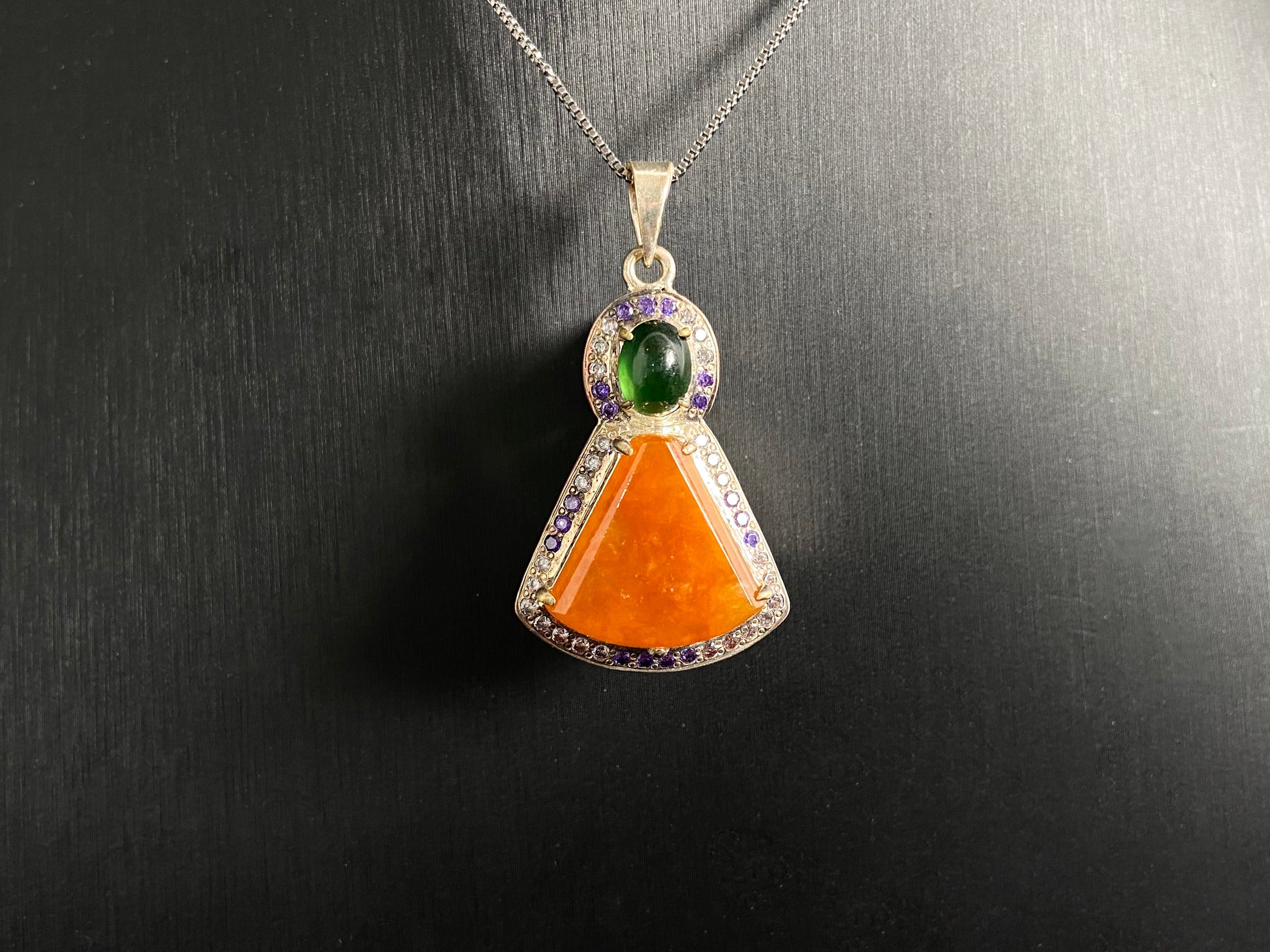 This unique pendant features an orange yellow "Wu Shi" plaque accented with a deep green jade bead, creating a striking color contrast.