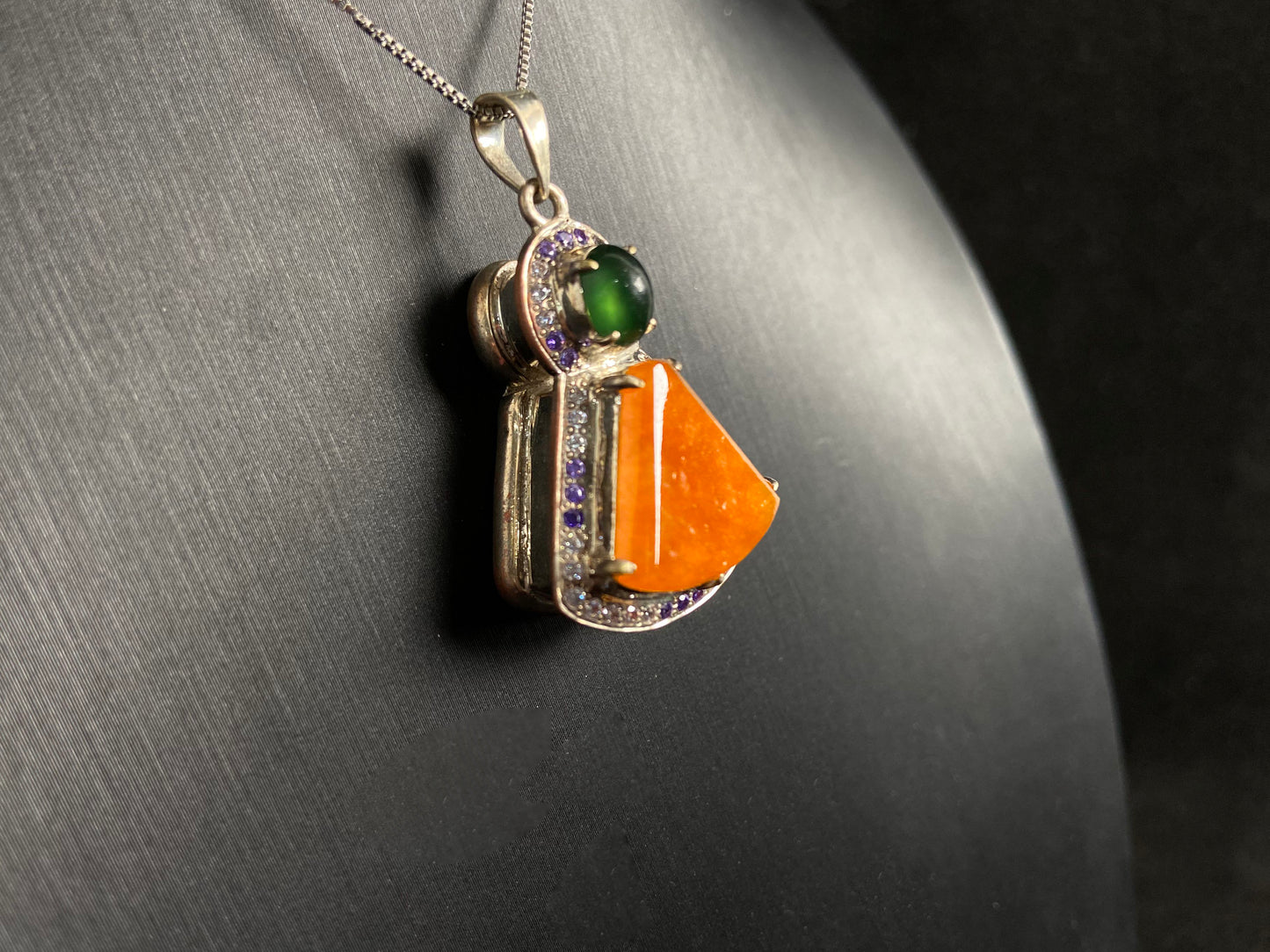 This unique pendant features an orange yellow "Wu Shi" plaque accented with a deep green jade bead, creating a striking color contrast.