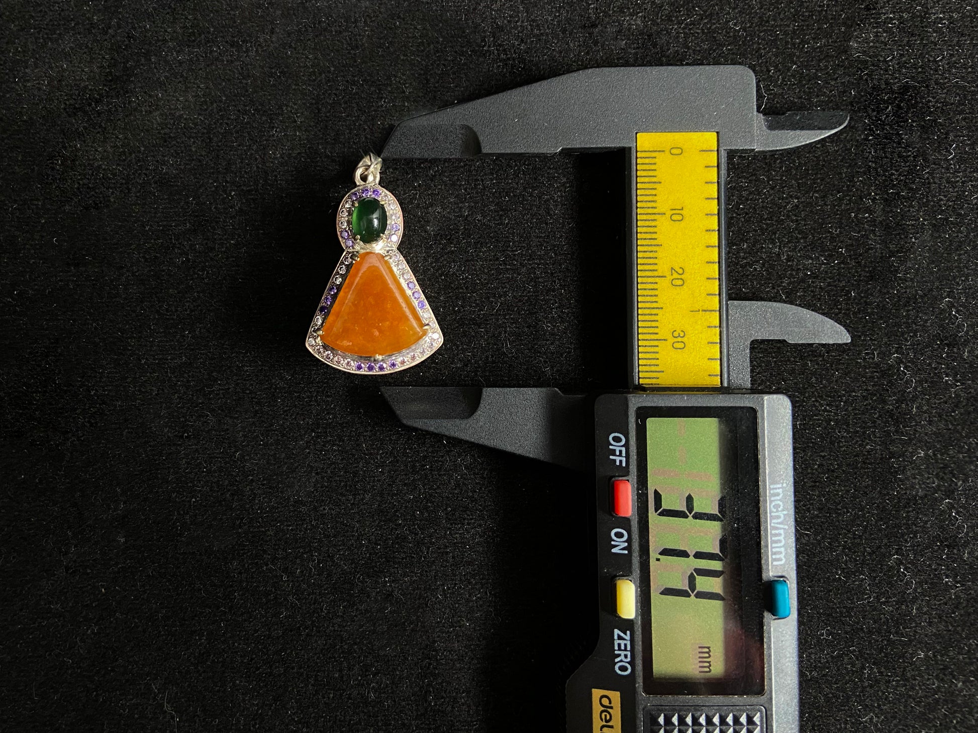 This unique pendant features an orange yellow "Wu Shi" plaque accented with a deep green jade bead, creating a striking color contrast.