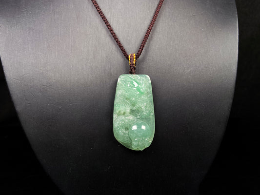 A green dragon playing pearl jadeite pendant.