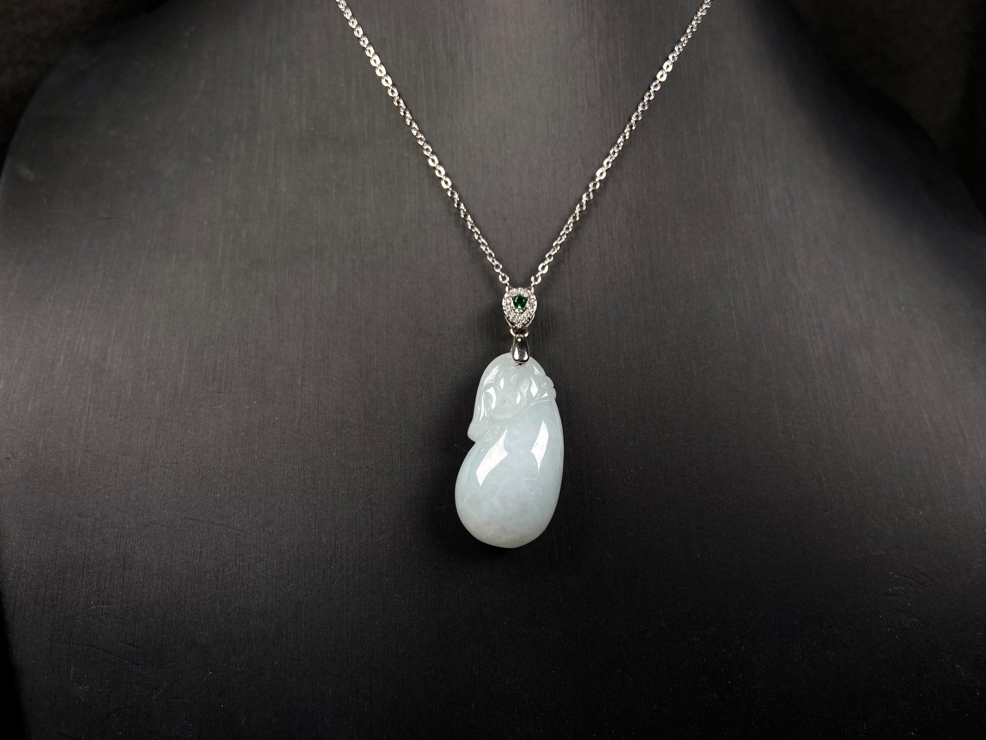 A pure white pouch jadeite pendant.