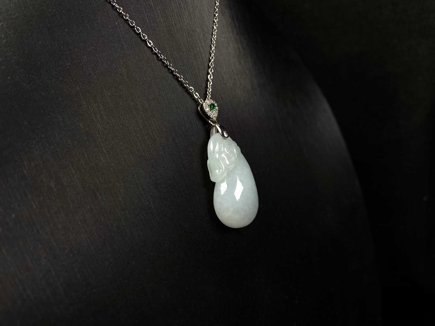A pure white pouch jadeite pendant.