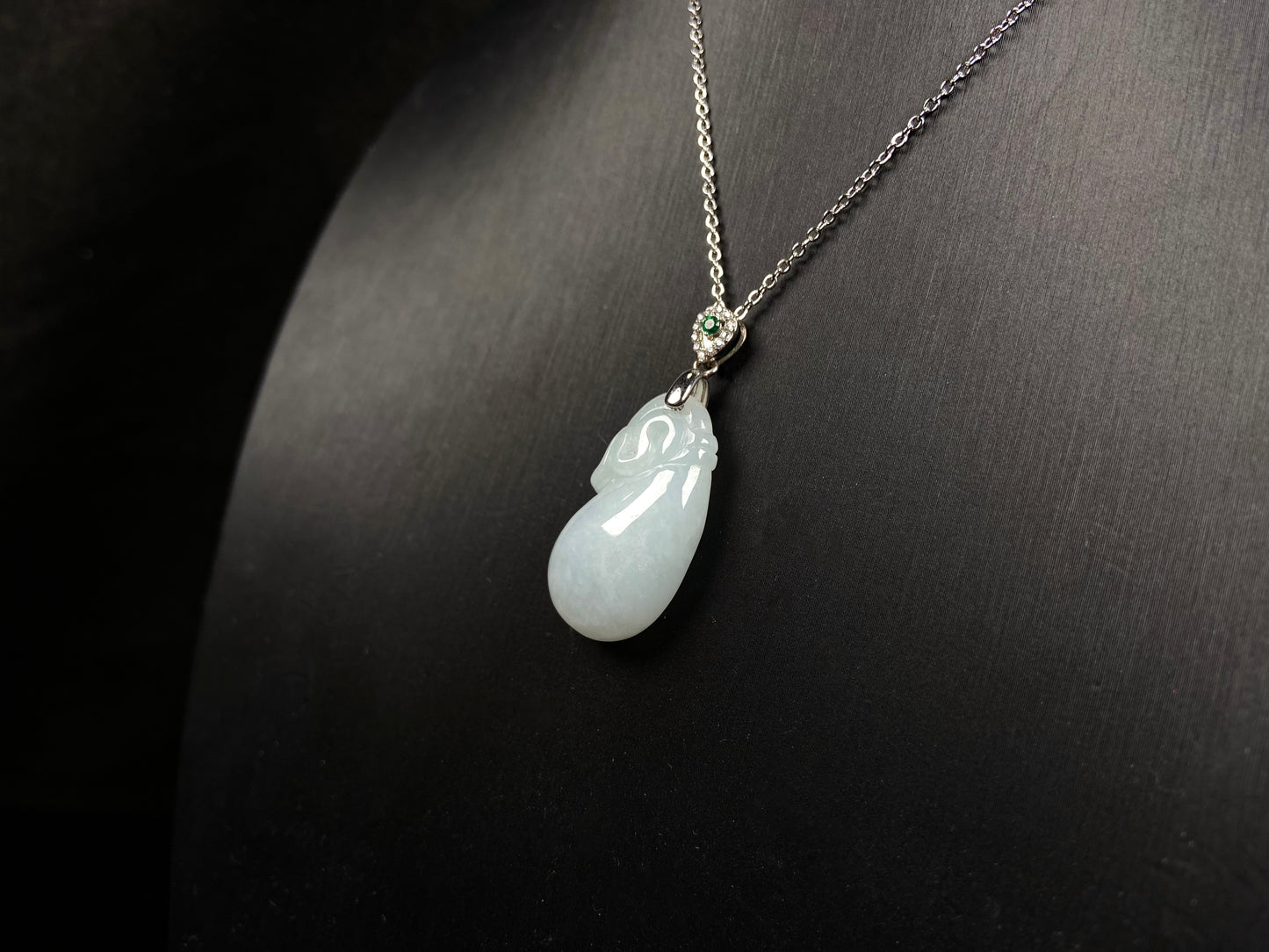 A pure white pouch jadeite pendant.