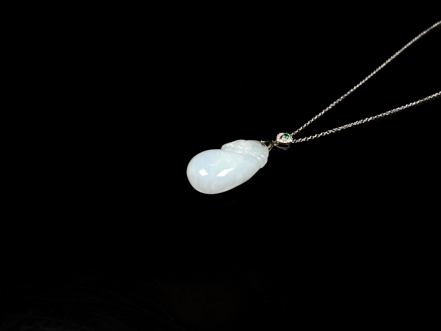 A pure white pouch jadeite pendant.