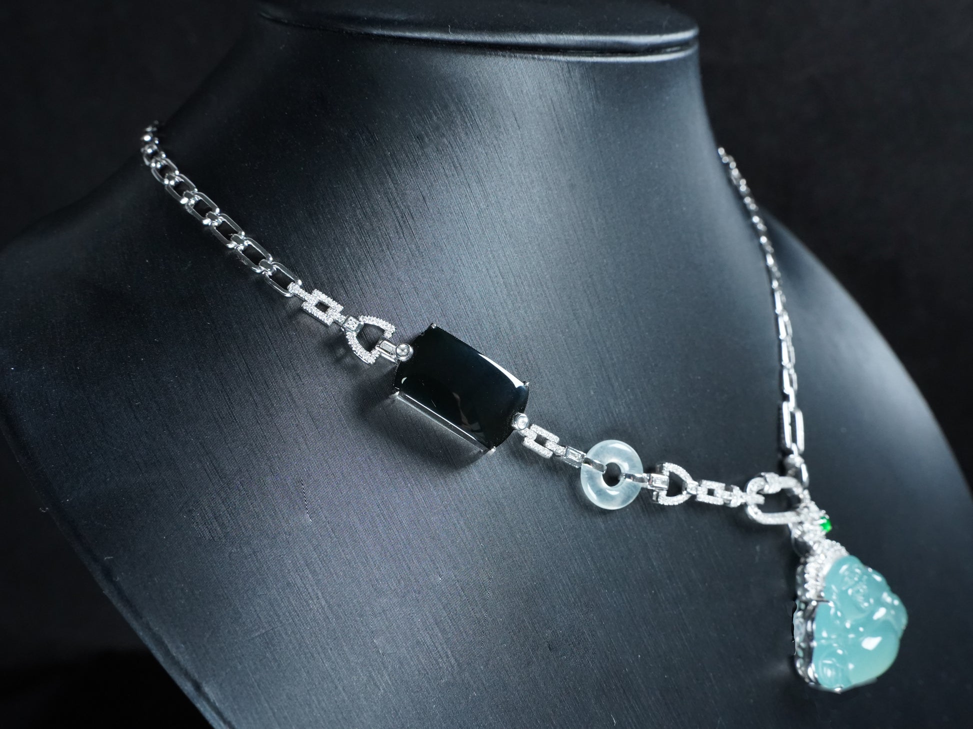 A icy blue laughing buddha jadeite pendant.