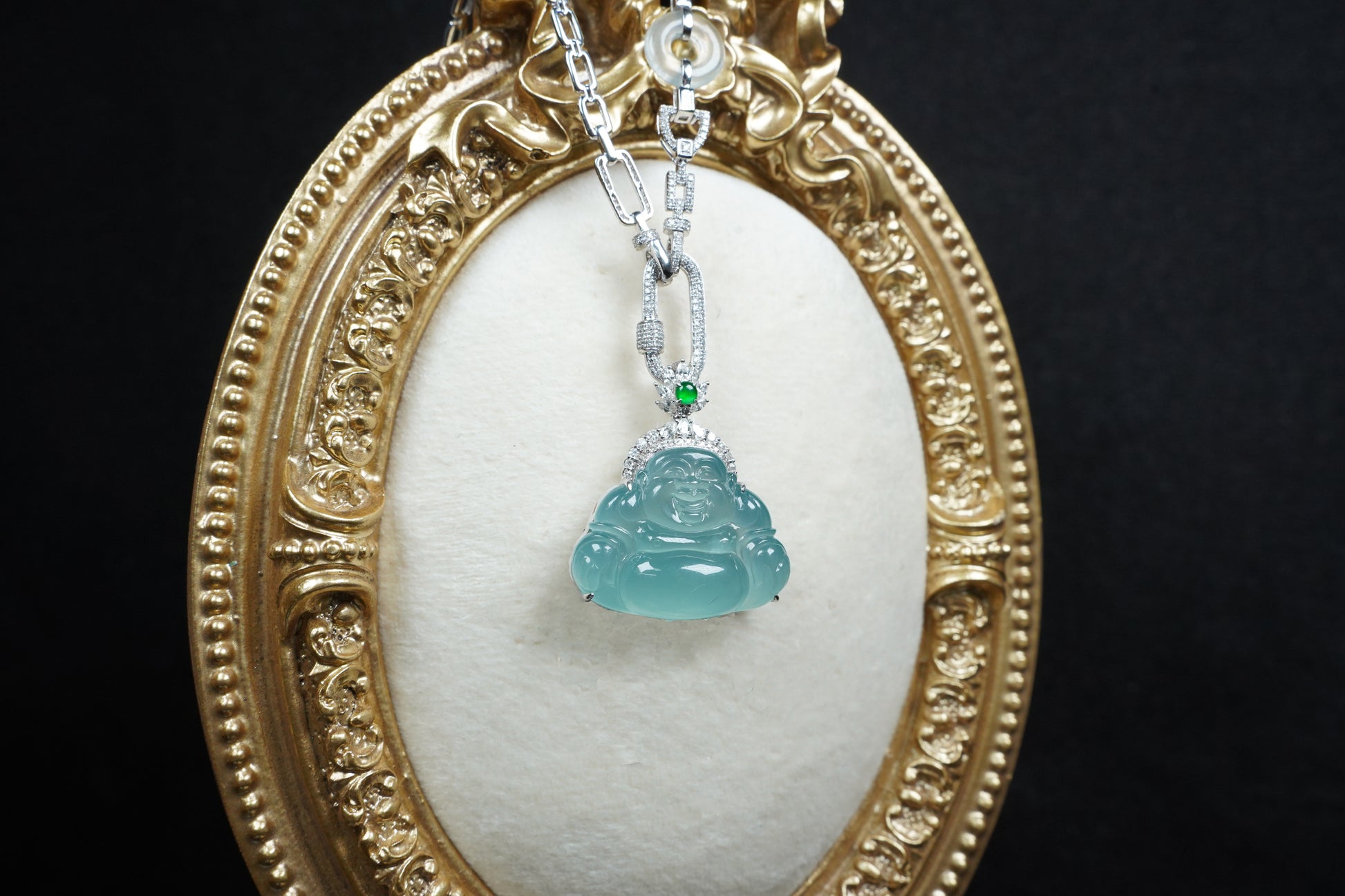 A icy blue laughing buddha jadeite pendant.