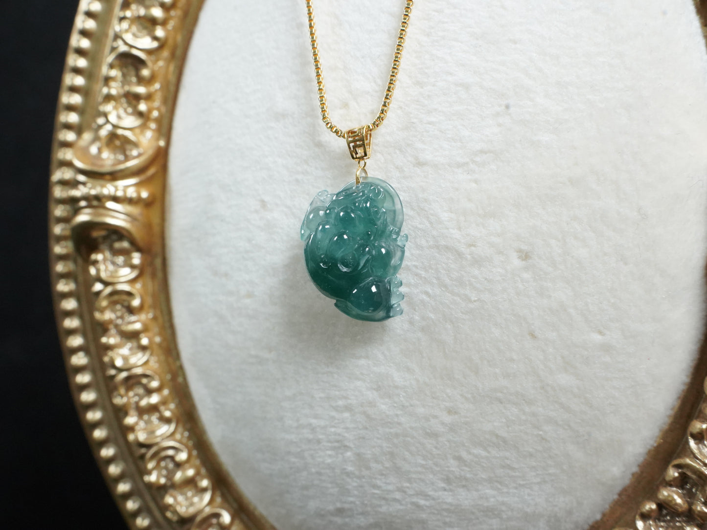 A lucky three legged toad jadeite pendant.