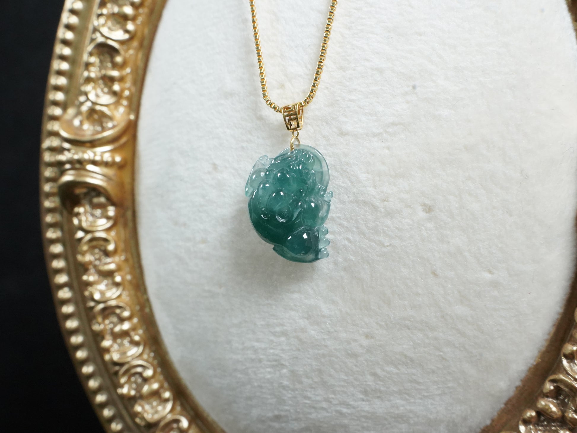 A lucky three legged toad jadeite pendant.