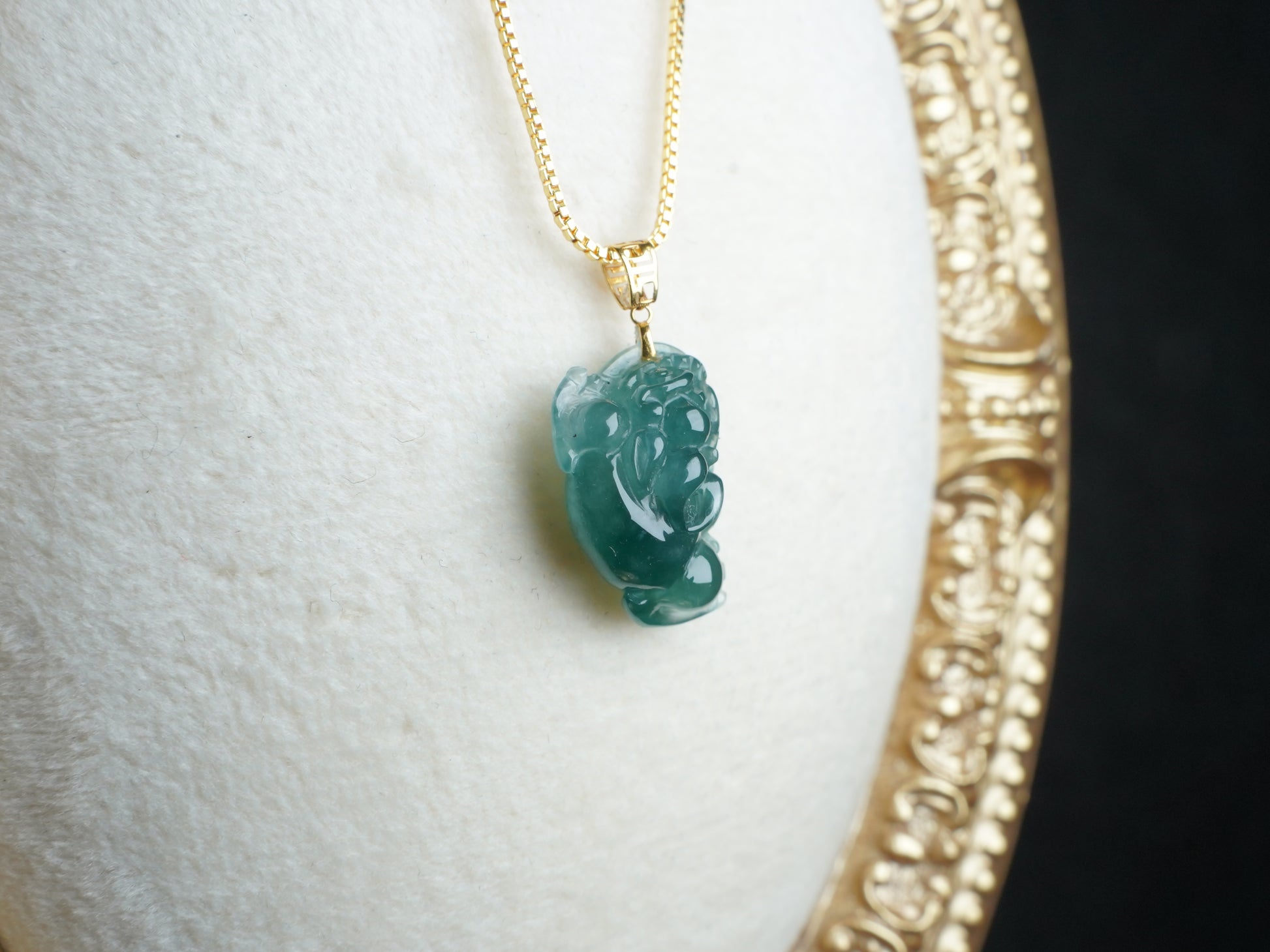 A lucky three legged toad jadeite pendant.