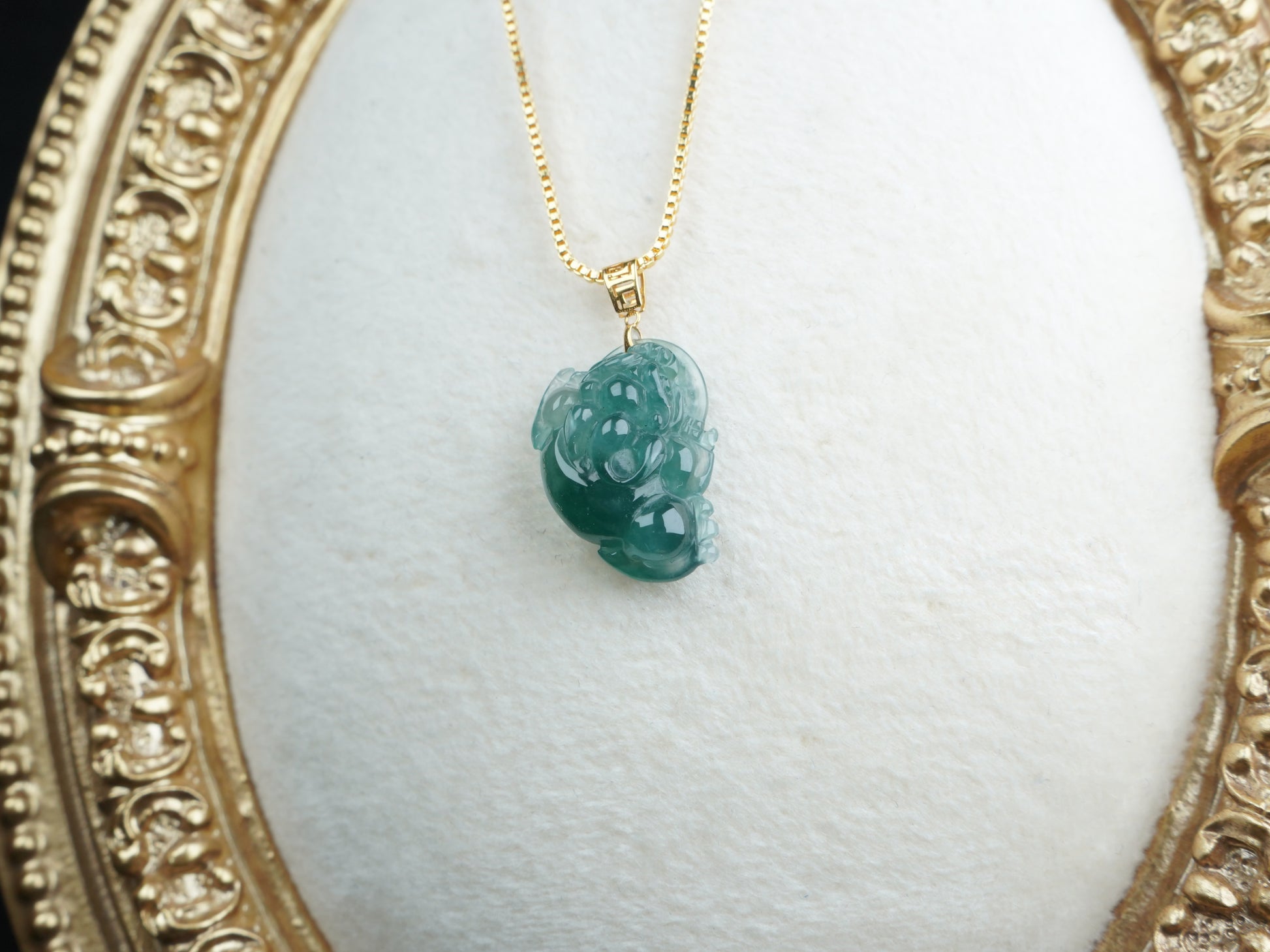 A lucky three legged toad jadeite pendant.