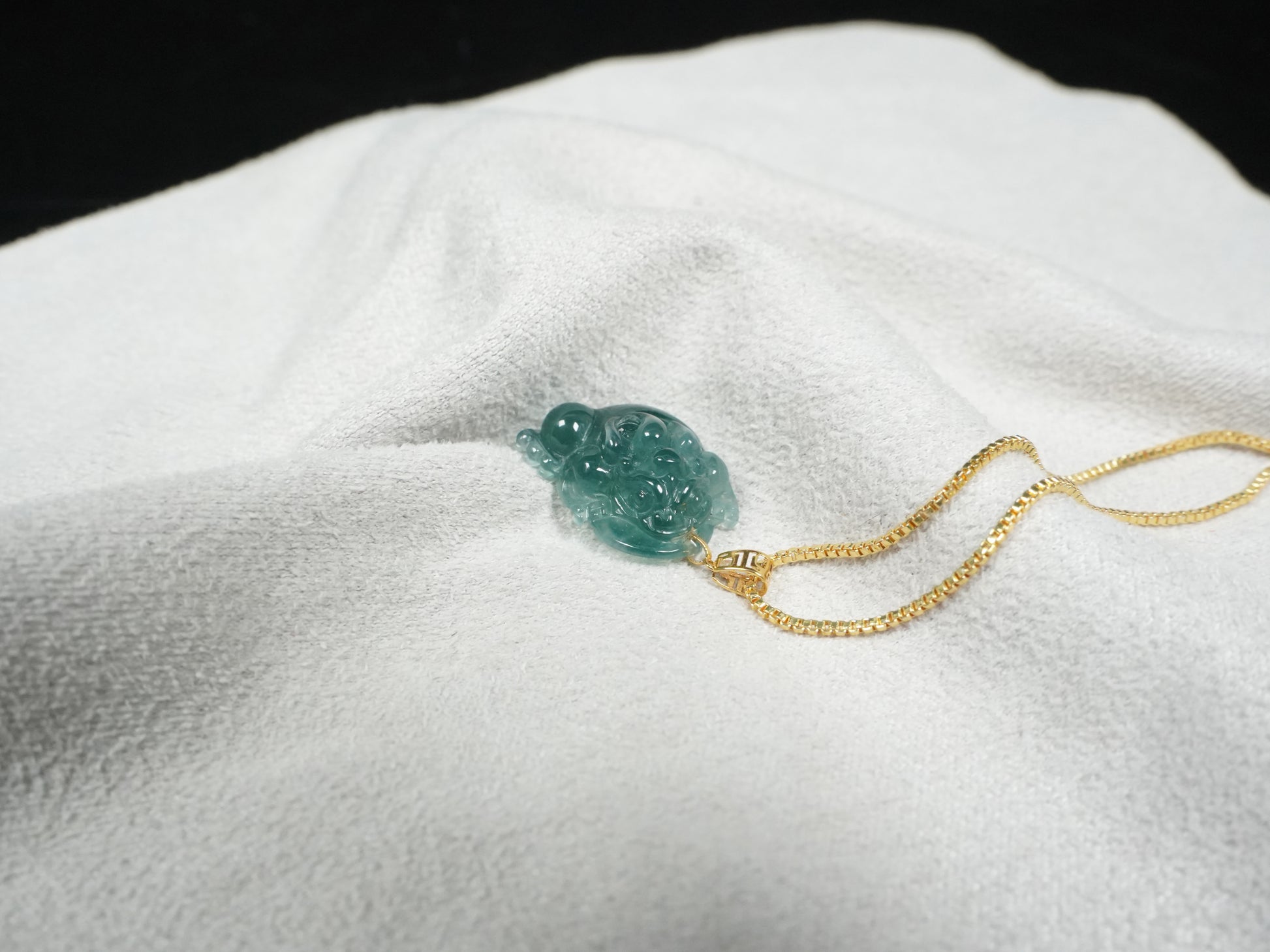 A lucky three legged toad jadeite pendant.