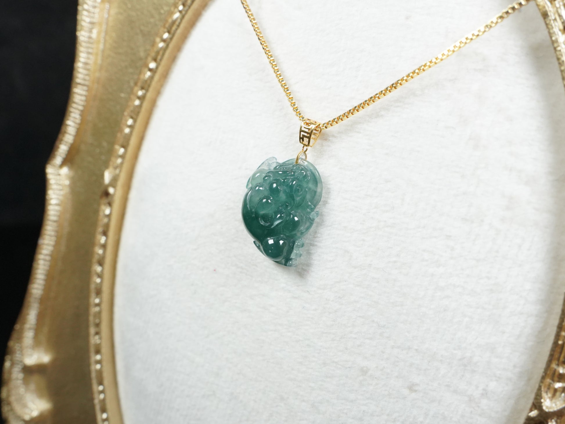 A lucky three legged toad jadeite pendant.