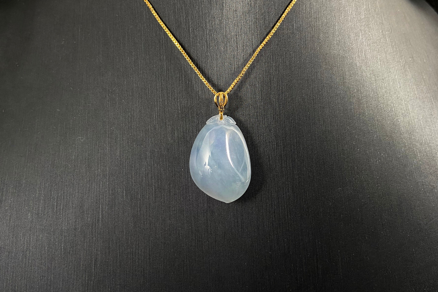 This translucent white jade peach pendant is elegantly complemented by a 925 silver gold plated clasp.