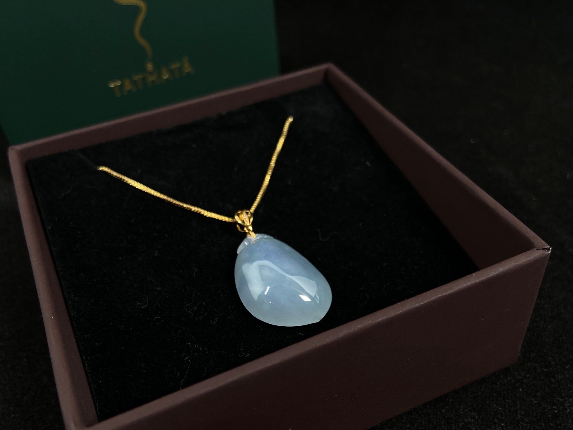 This translucent white jade peach pendant is elegantly complemented by a 925 silver gold plated clasp.