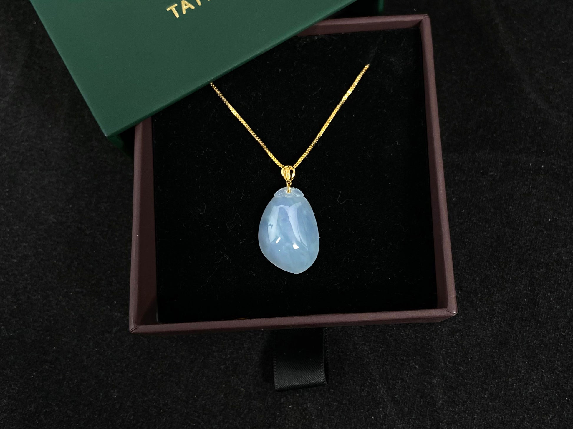 This translucent white jade peach pendant is elegantly complemented by a 925 silver gold plated clasp.
