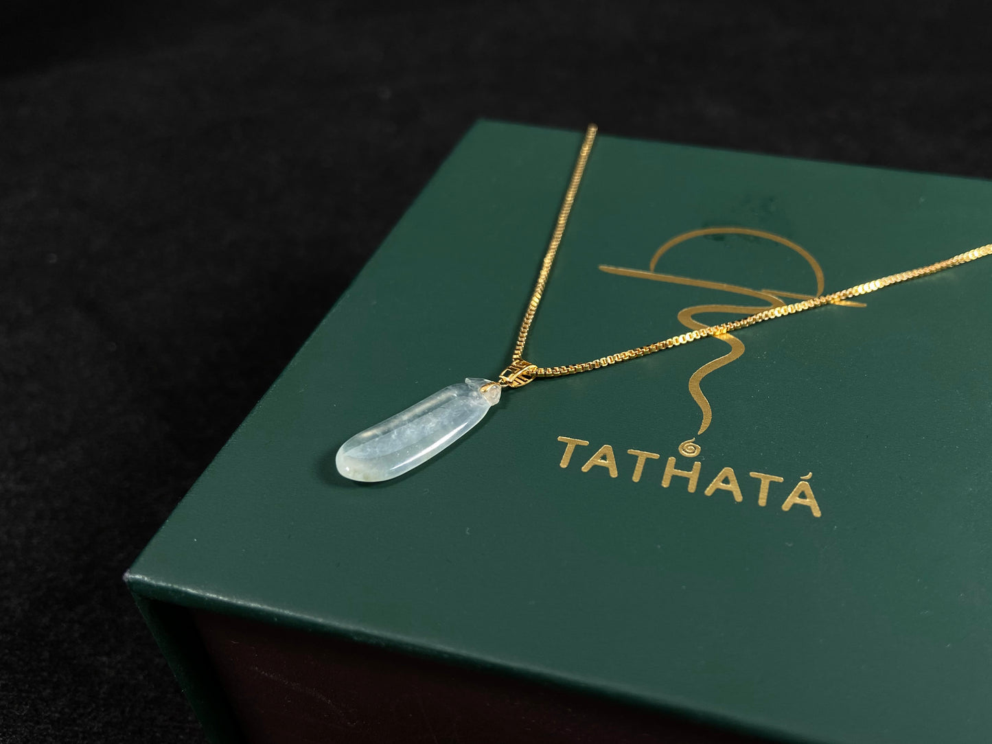 An ice jadeite pendant carved as a blessing melon.